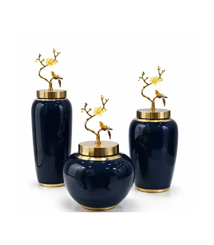 ست سه‌سایز جار چینی سرمه‌ای براق با لبه طلایی و درب برنزی طرح شاخه و پرنده